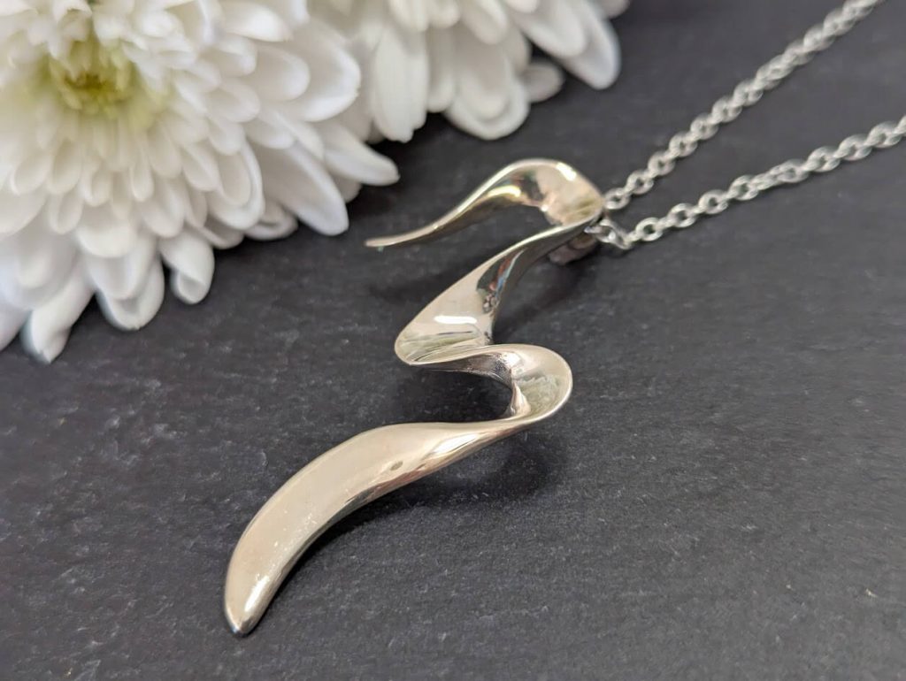 modernist twist sterling silver pendant
